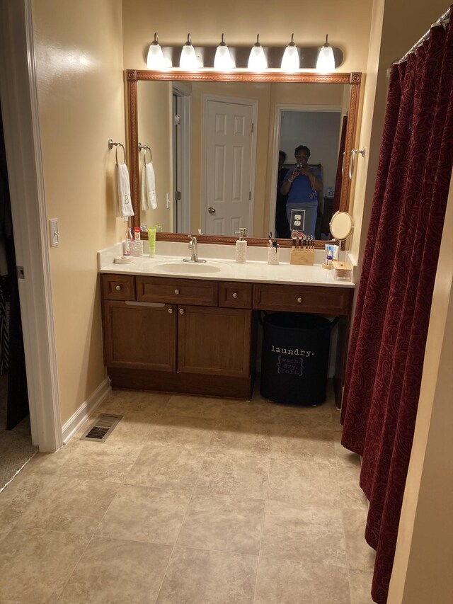 bathroom with vanity and tile patterned floors