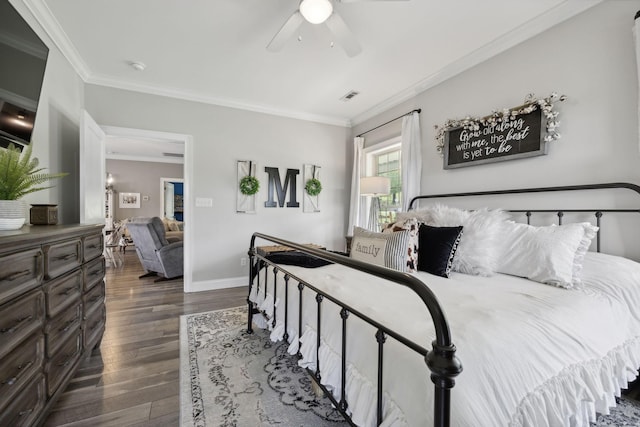 bedroom featuring dark hardwood / wood-style flooring, crown molding, and ceiling fan