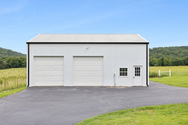 garage featuring a lawn