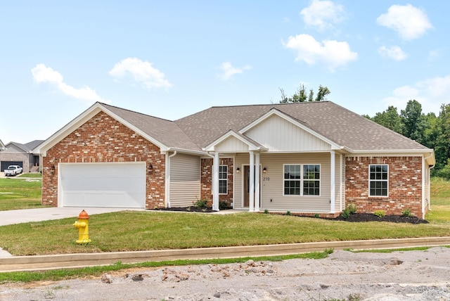 view of front of home with a garage and a front lawn