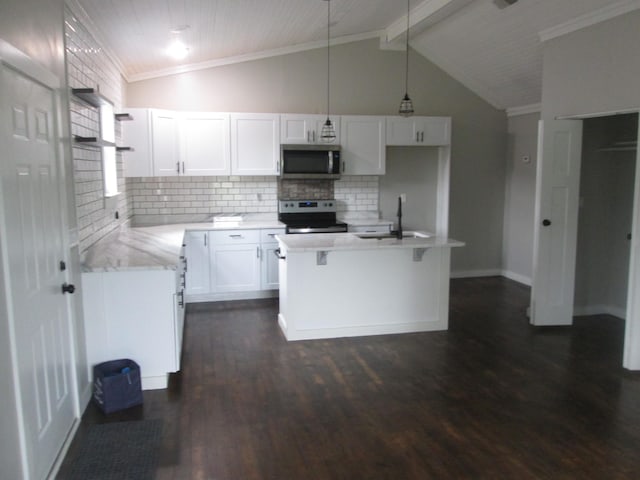 kitchen with sink, appliances with stainless steel finishes, white cabinetry, hanging light fixtures, and beam ceiling