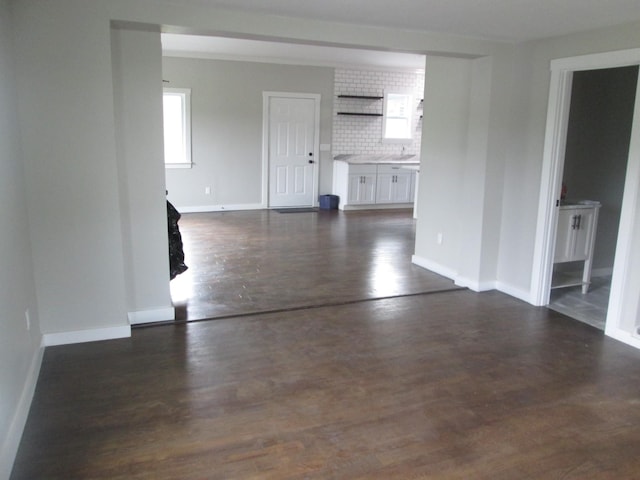 empty room with dark wood-type flooring