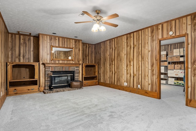 unfurnished living room with light colored carpet and wooden walls