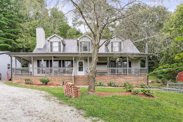 view of front of house featuring covered porch and a front lawn