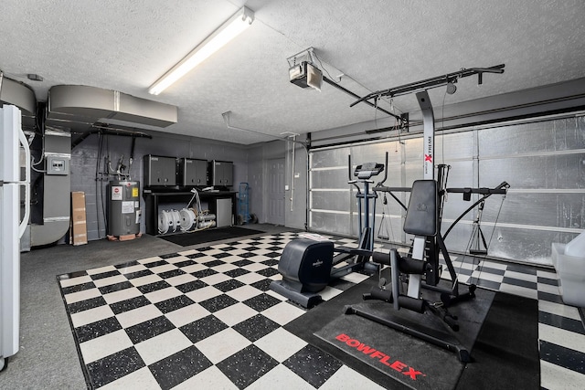 exercise room with water heater and a textured ceiling