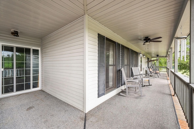 view of patio featuring ceiling fan and a porch