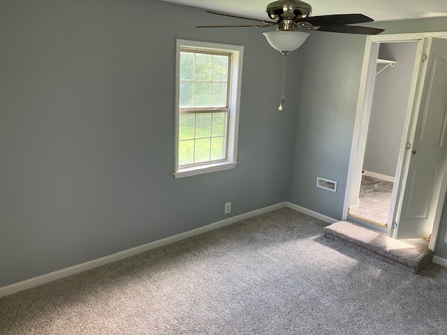 unfurnished bedroom with carpet flooring, a closet, and ceiling fan