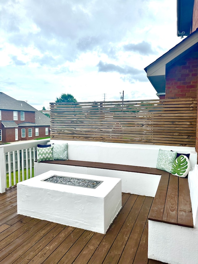 deck with an outdoor fire pit