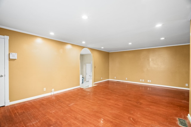 unfurnished room featuring hardwood / wood-style floors and ornamental molding