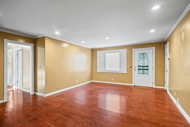 interior space with wood-type flooring and ornamental molding