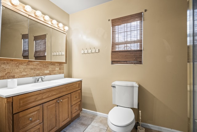 bathroom featuring decorative backsplash, vanity, tile patterned floors, and toilet