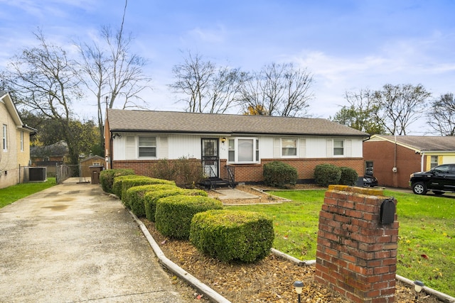 single story home featuring central AC unit and a front yard