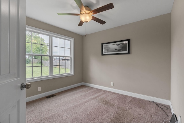 carpeted empty room with ceiling fan