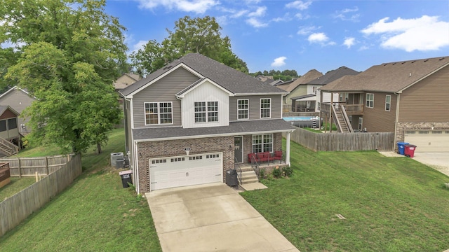 view of front of house with a garage and a front yard