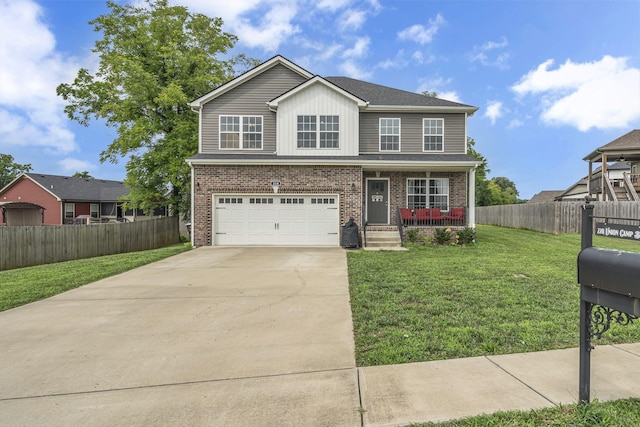 view of front of house with a garage, covered porch, and a front yard