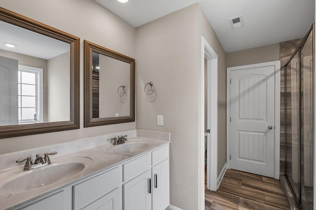 bathroom with vanity and wood-type flooring