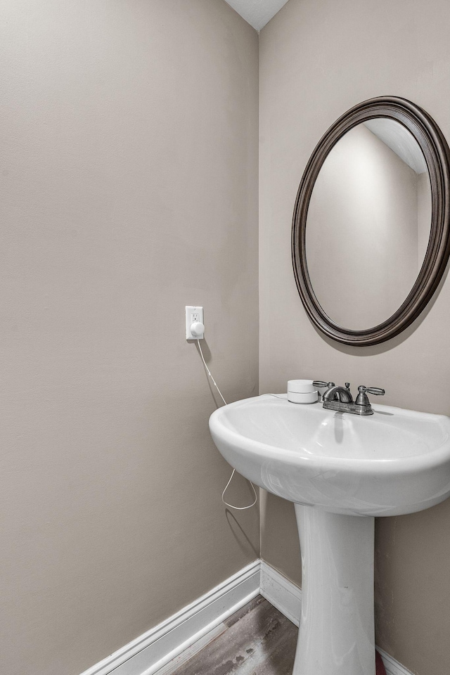 bathroom featuring sink and hardwood / wood-style flooring