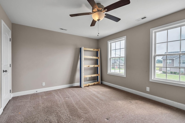 unfurnished bedroom featuring ceiling fan and carpet flooring