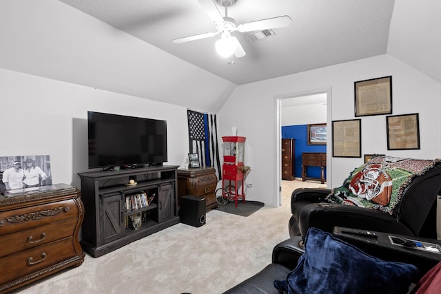 living room featuring lofted ceiling, light colored carpet, and ceiling fan