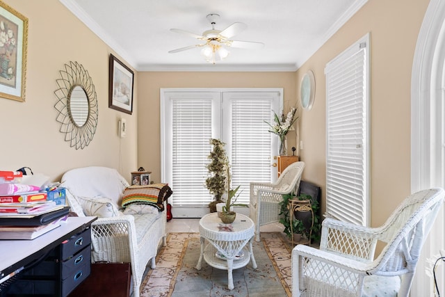 sitting room featuring ceiling fan and ornamental molding