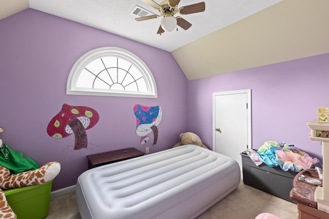 carpeted bedroom featuring lofted ceiling and ceiling fan