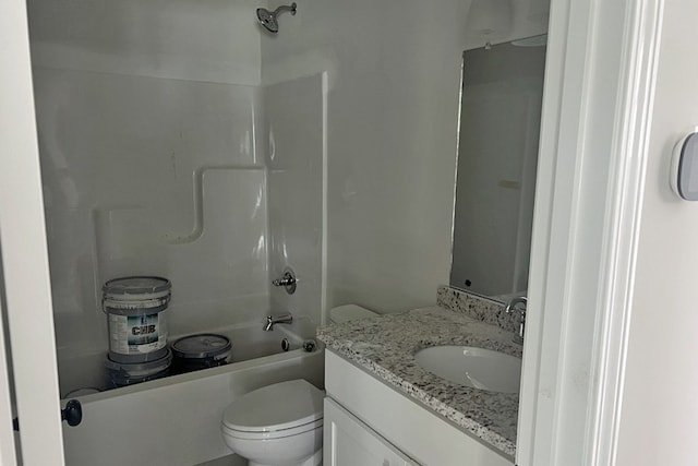 bathroom featuring shower / washtub combination, vanity, and toilet