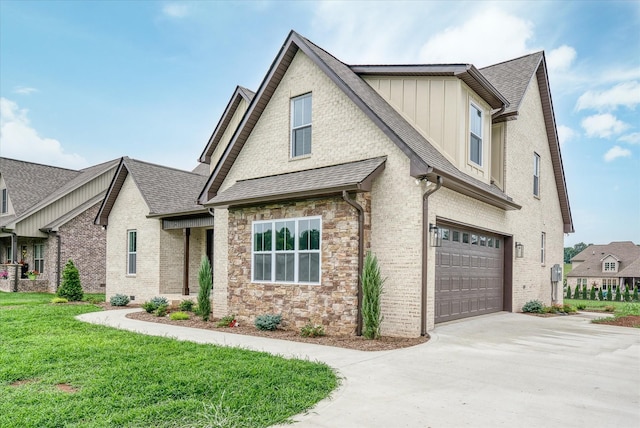 view of front of property with a garage and a front yard