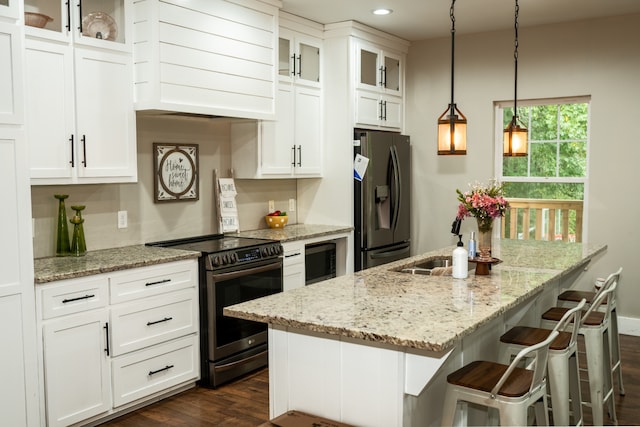 kitchen featuring premium range hood, electric stove, stainless steel refrigerator with ice dispenser, a breakfast bar area, and dark wood-type flooring