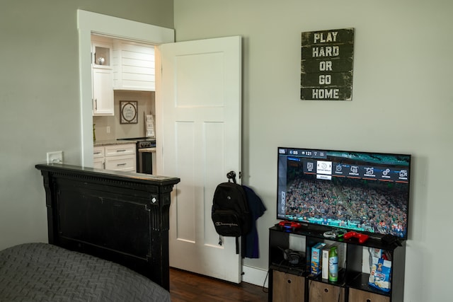 bedroom featuring dark hardwood / wood-style flooring