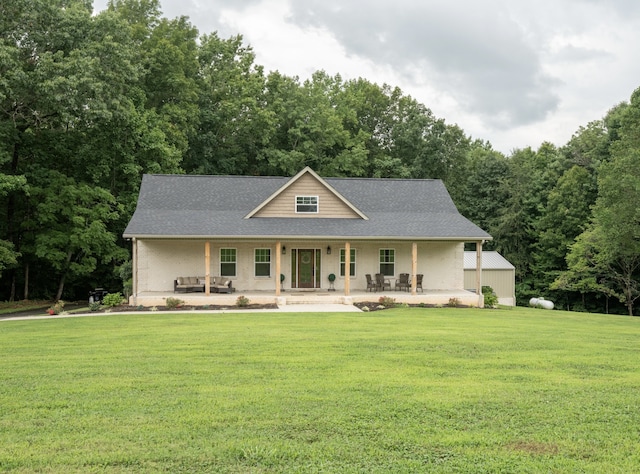 view of front facade featuring covered porch and a front lawn