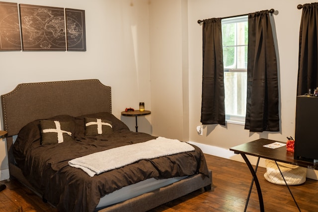 bedroom featuring wood-type flooring