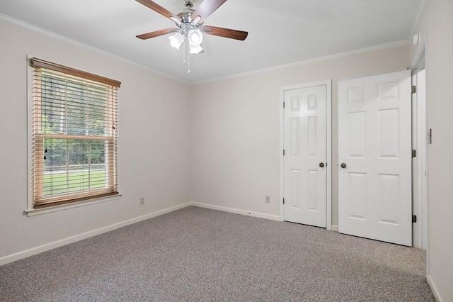 unfurnished bedroom featuring light carpet, ornamental molding, and ceiling fan