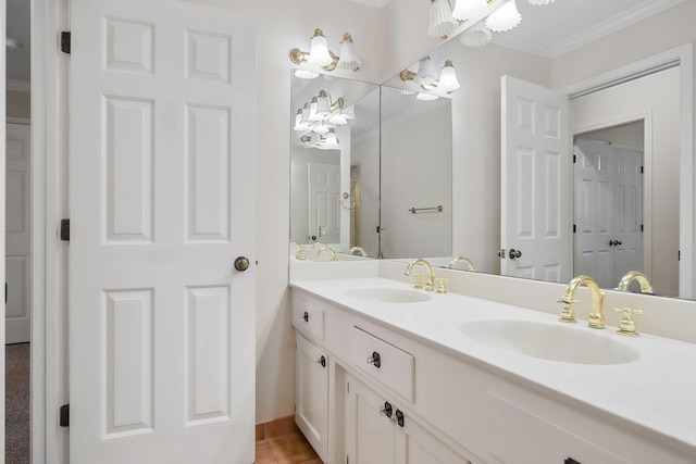 bathroom featuring crown molding, tile patterned floors, and vanity