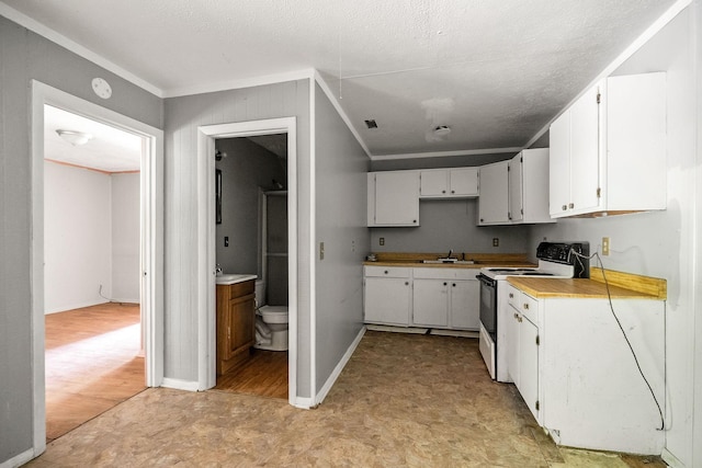 kitchen with crown molding, white electric range, sink, and white cabinets