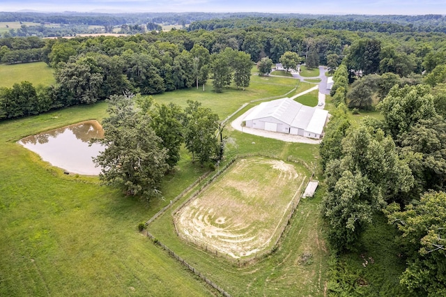 birds eye view of property with a water view and a rural view