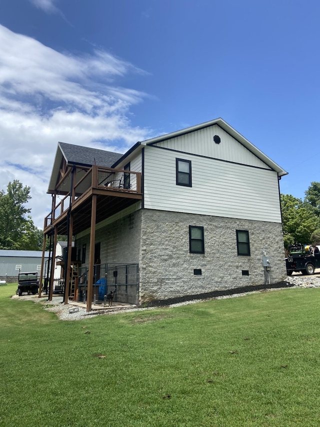 view of property exterior with a yard and a deck