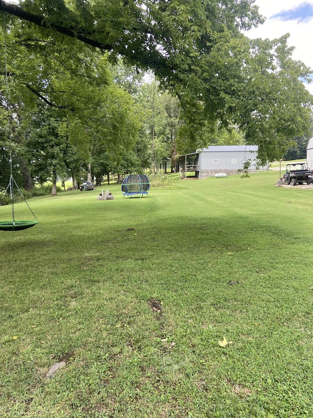 view of yard with a trampoline