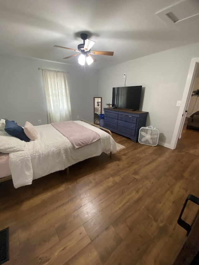 bedroom featuring ceiling fan and dark hardwood / wood-style floors