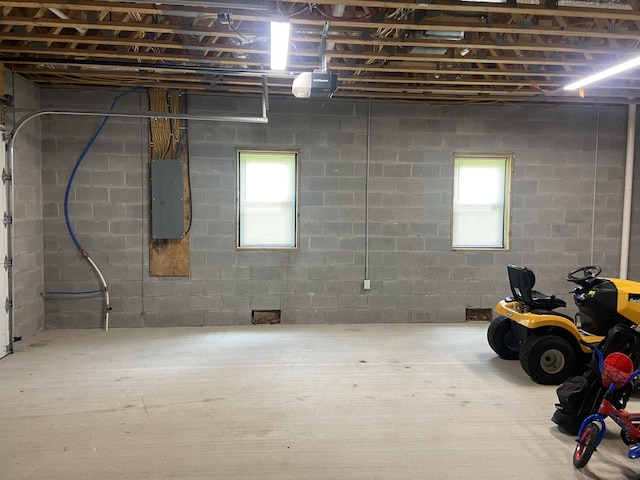 basement with plenty of natural light and electric panel