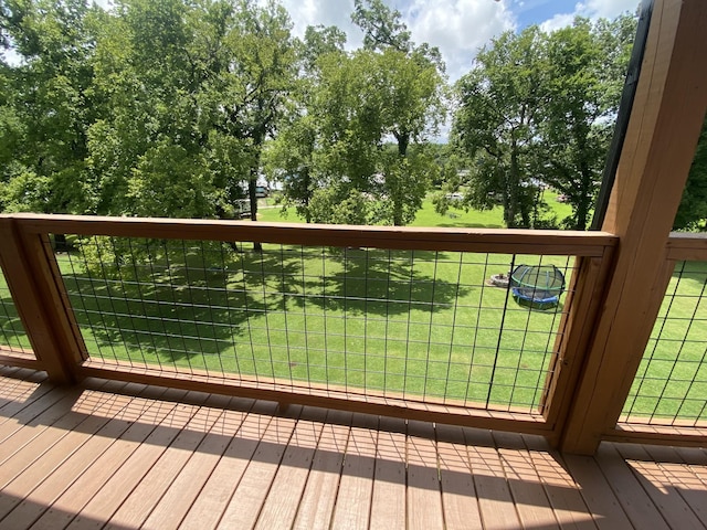 wooden terrace with a yard