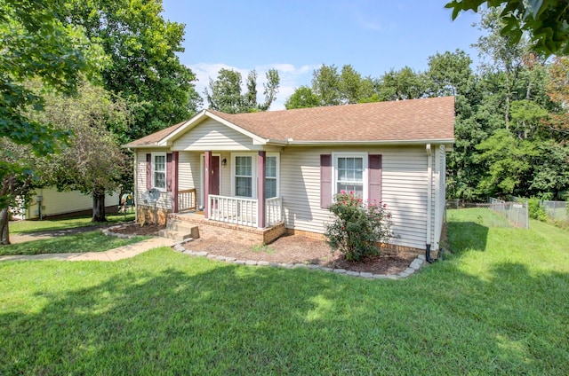 view of front facade featuring covered porch and a front yard