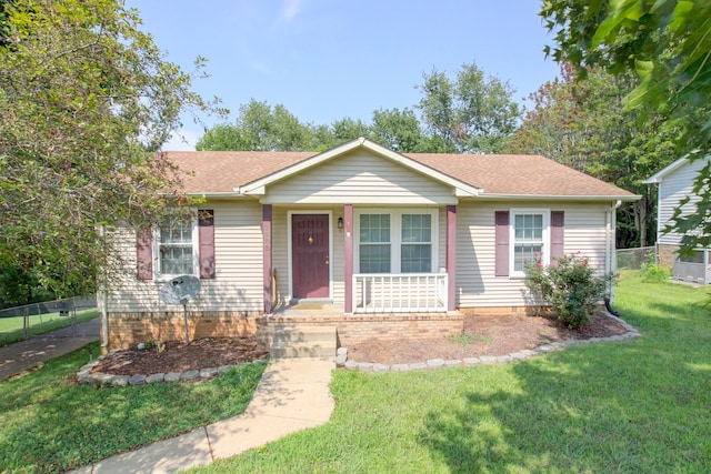 single story home with a front lawn and a porch