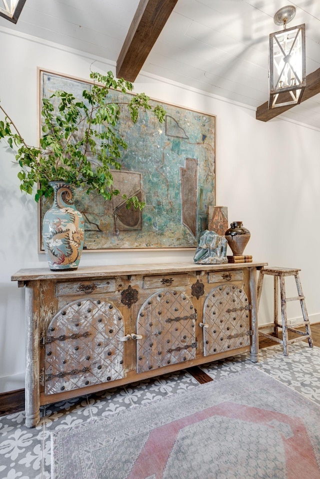 room details with ornamental molding and beam ceiling