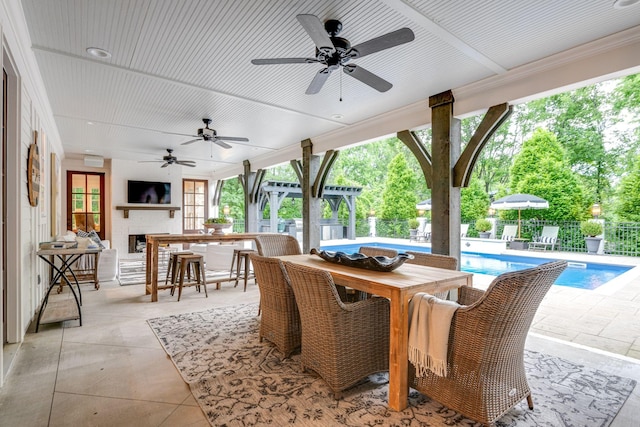 view of patio / terrace with a bar and ceiling fan