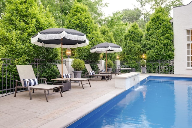 view of pool featuring a patio area and pool water feature