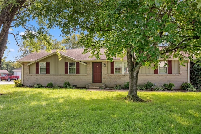 single story home featuring a garage and a front lawn