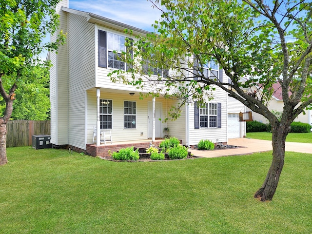 view of front facade with a front yard and a garage