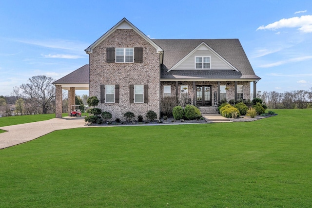 craftsman house with a front yard and covered porch