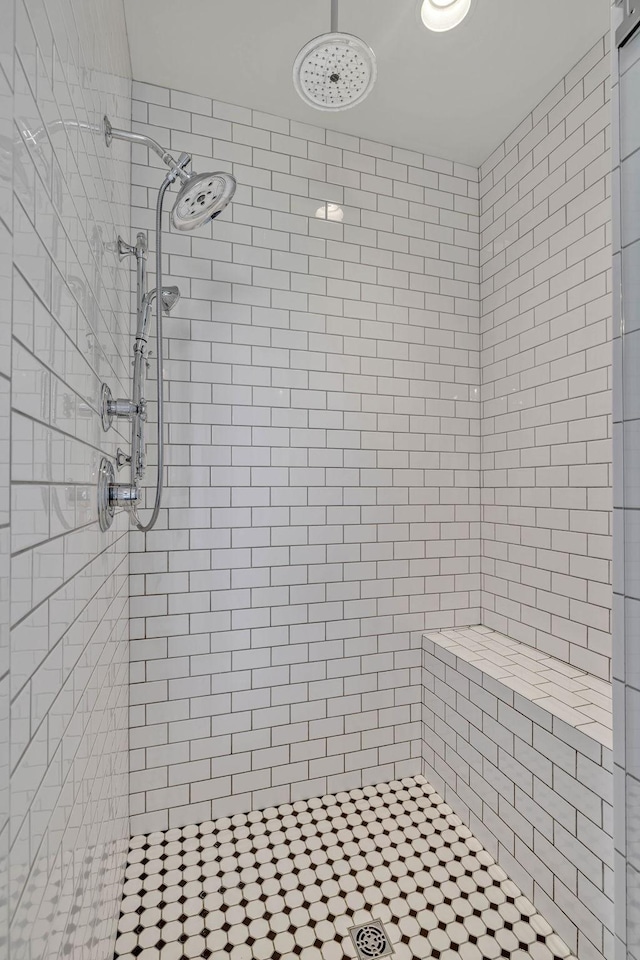 bathroom with tiled shower