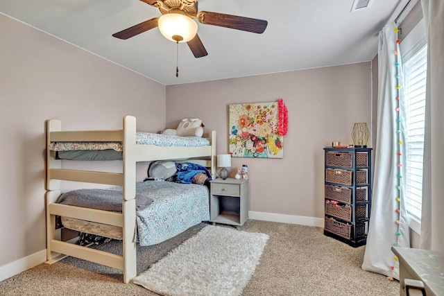 bedroom featuring light colored carpet and ceiling fan